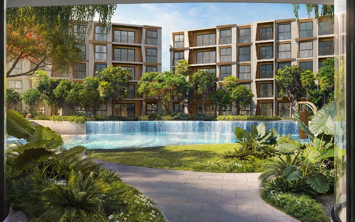 Rhea by Sansiri residential buildings surrounding a landscaped waterfall pool